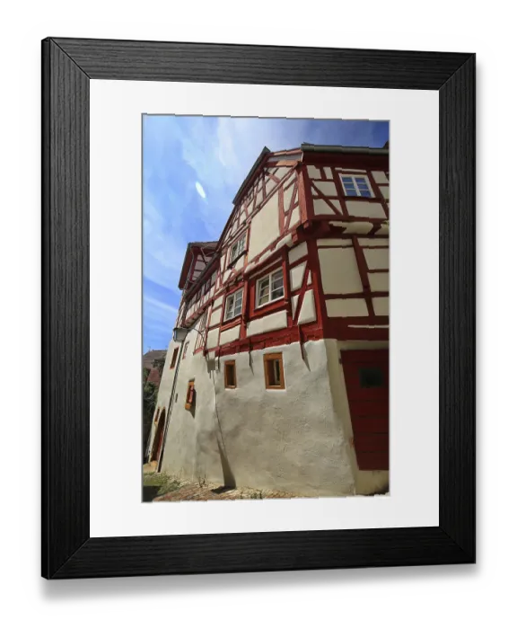 Framed Print : Another half-timbered house with red beams and traditional design under a blue sky in Bad Wimpfen