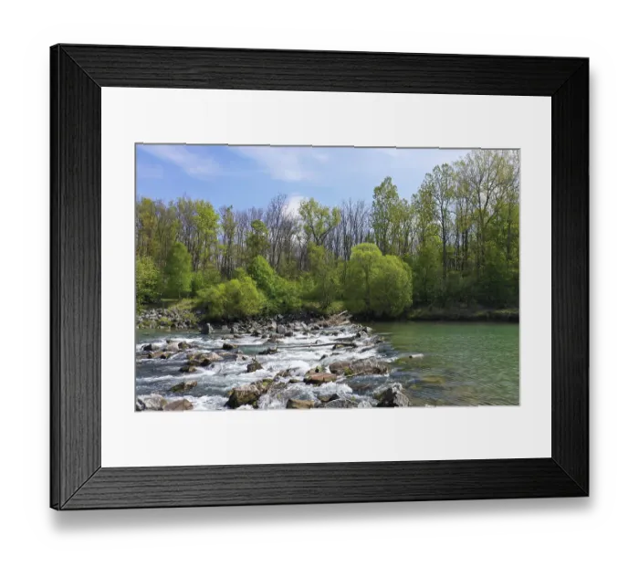 Framed Print : River with running water and surrounding trees and stones