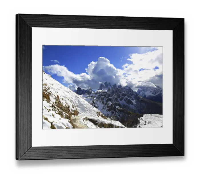 Framed Print : View of the Three Peaks with clouds and mountain trail in the foreground under bright sun