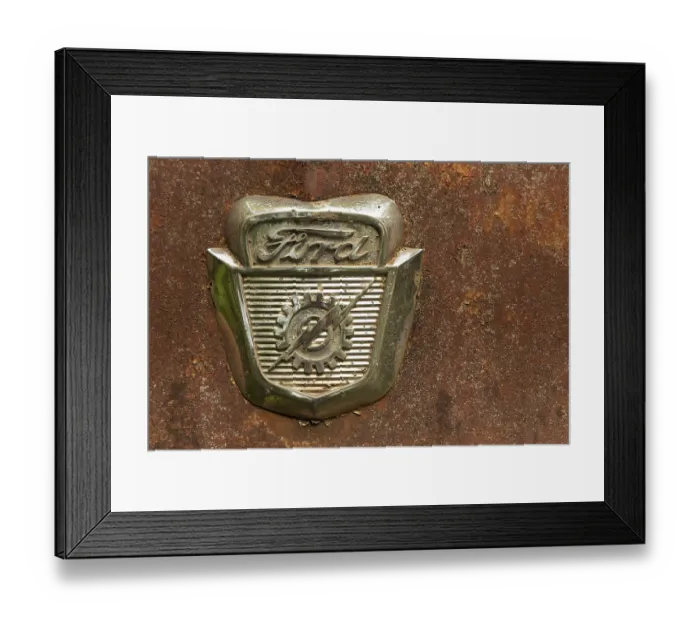 Framed Print : Ford Logo on a old car