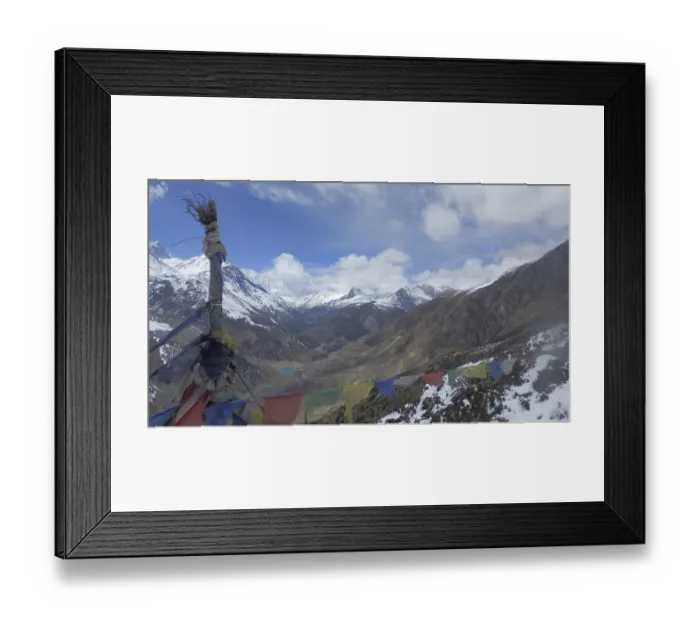 Framed Print : Wide mountain landscape with colorful prayer flags and snow-capped peaks under blue sky Framed Print : Wide mountain landscape with colorful prayer flags and snow-capped peaks under blue sky