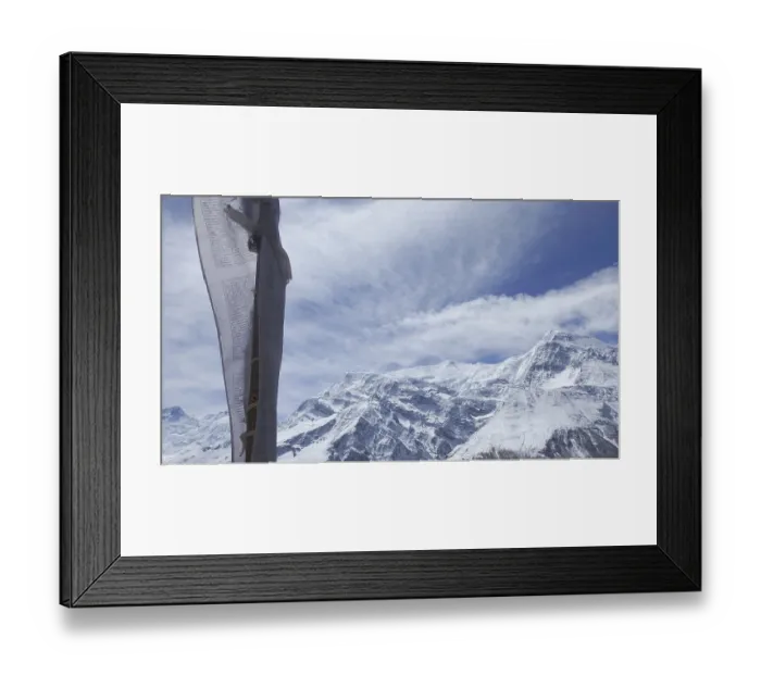 Framed Print : Close-up of a prayer flag in the foreground in front of majestic snow-capped mountain peaks Framed Print : Close-up of a prayer flag in the foreground in front of majestic snow-capped mountain peaks