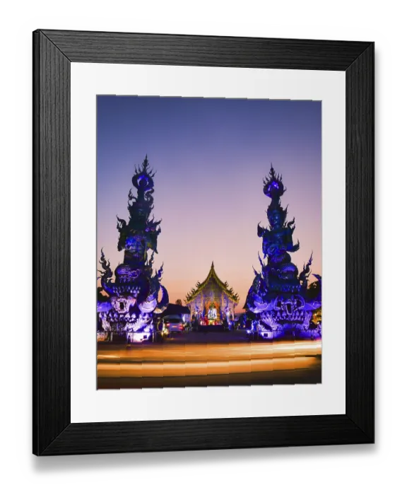 Framed Print : Vertical view vibrant Blue Temple Wat Rong Suea Ten in Chiang Rai Thailand at sunset with colorful glowing sculptures