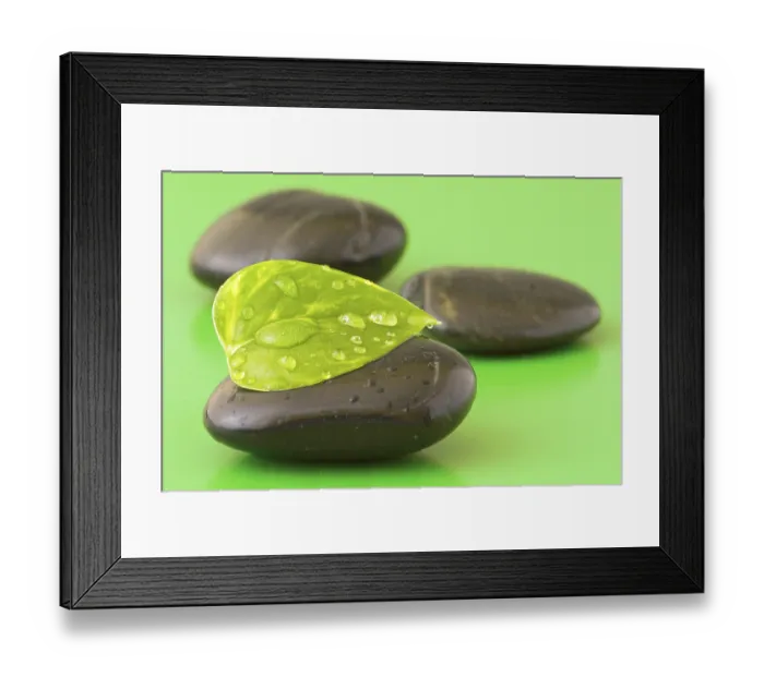 Framed Print : Zen stones with leaf on green background Framed Print : Zen stones with leaf on green background