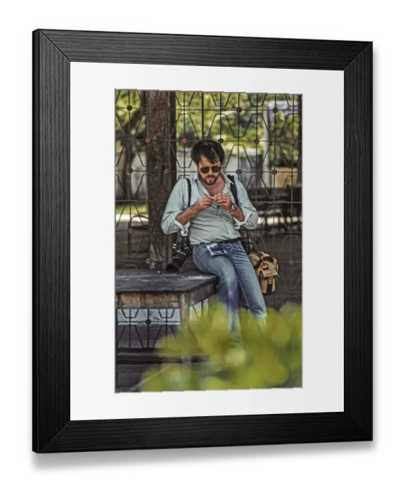 Framed Print : Photographer rolling a cigarette