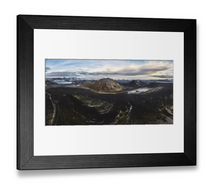 Framed Print : A breathtaking view of a volcanic mountain surrounded by lush green moss