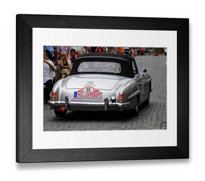 Framed Print : A silver Mercedes classic car convertible drives through a busy road