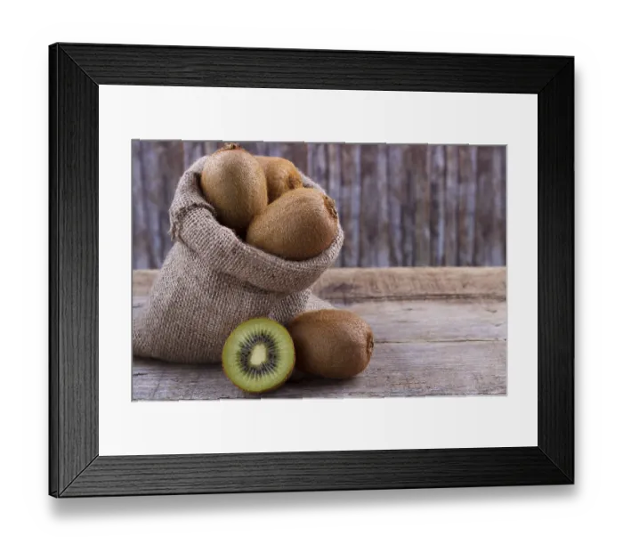 Framed Print : Fresh kiwi in a sack on an old wooden board