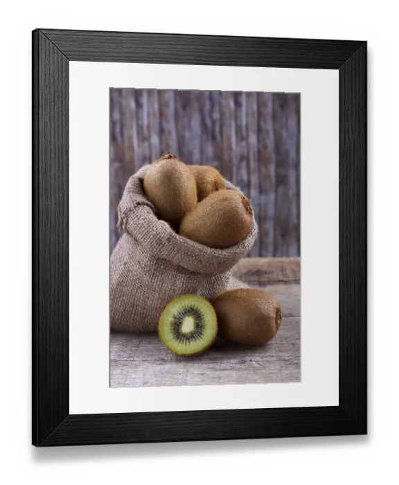 Framed Print : Fresh kiwi in burlap sack on old rustic wooden table