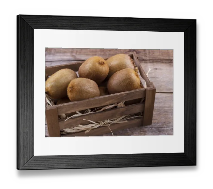 Framed Print : Box of fresh kiwi in on wooden background