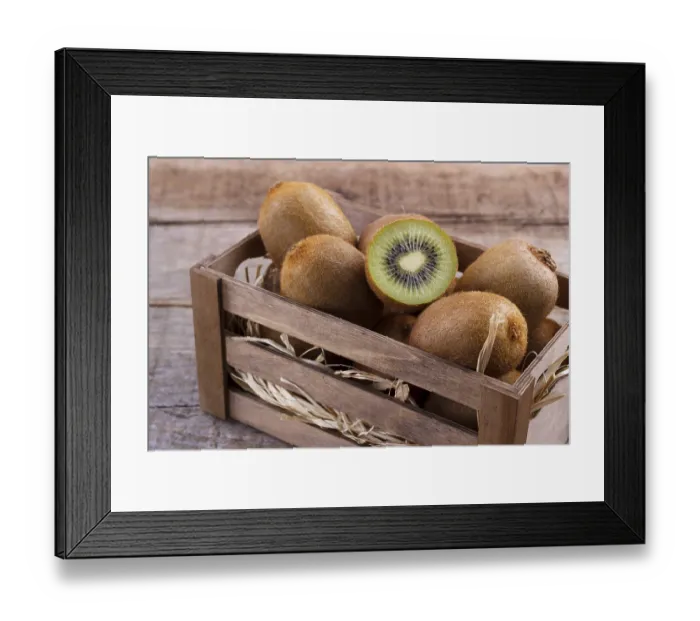 Framed Print : Box of fresh kiwi in on wooden background