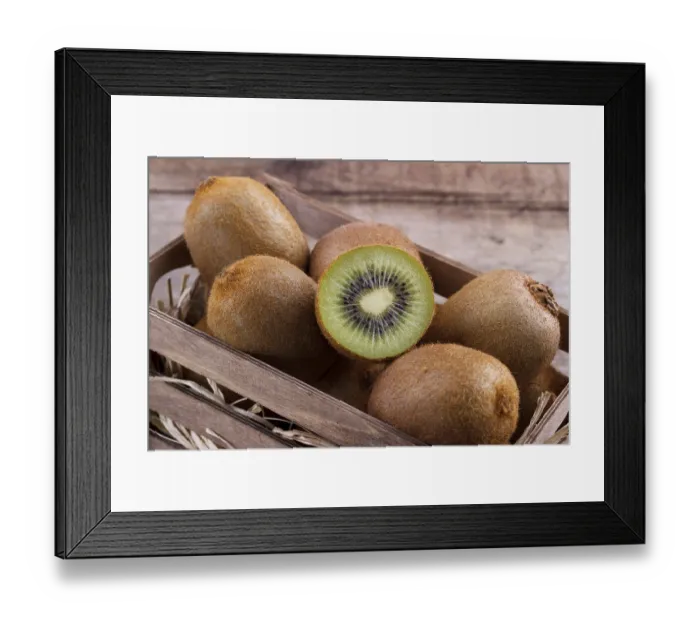 Framed Print : Box of fresh kiwi in on wooden background