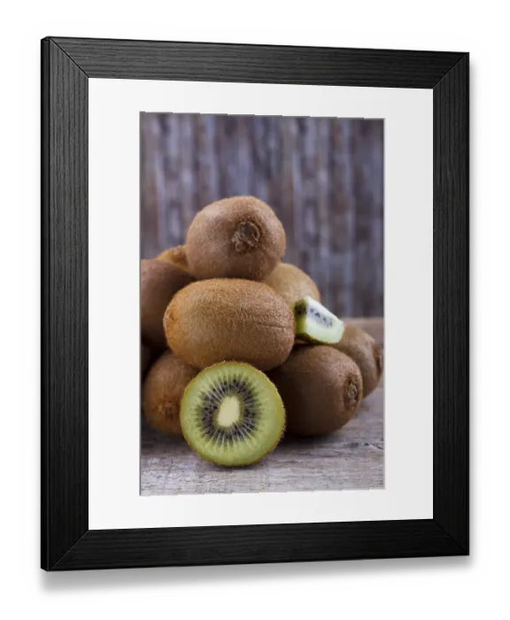 Framed Print : Closeup of ripe kiwi on old rustic wooden table