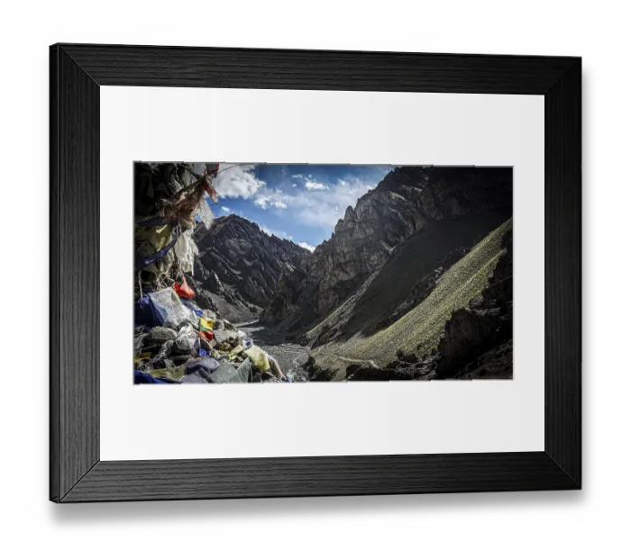 Framed Print : Mountain valley with prayer flags and dry riverbed surrounded by shady mountains Framed Print : Mountain valley with prayer flags and dry riverbed surrounded by shady mountains