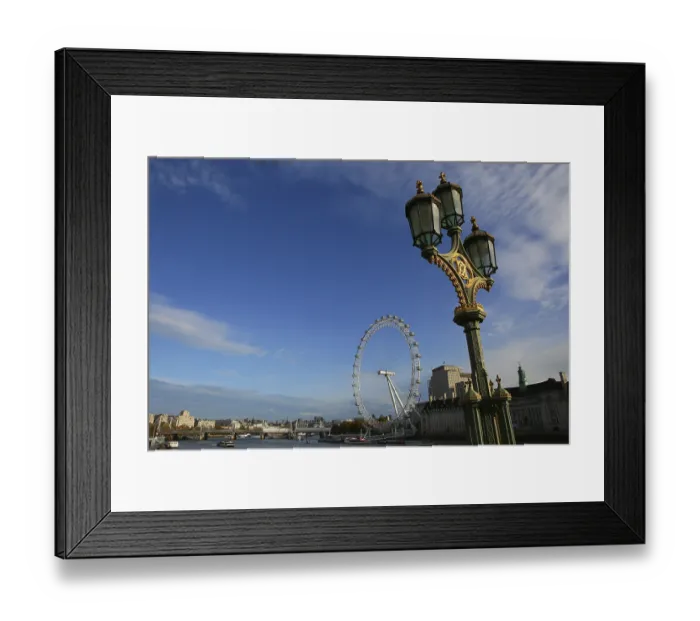 Framed Print : Atmospheric shot of a Ferris wheel on a clear day with an antique street lamp in the foreground