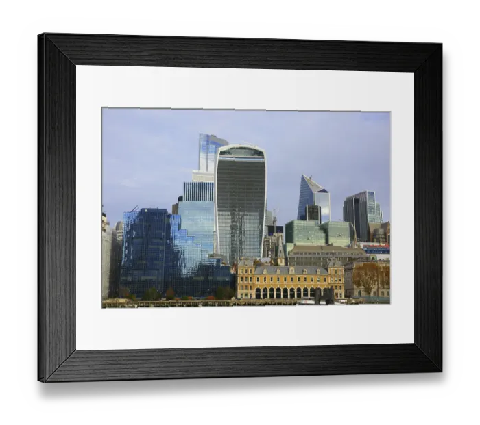 Framed Print : Modern skyscrapers with distinctive glass facades under clear skies