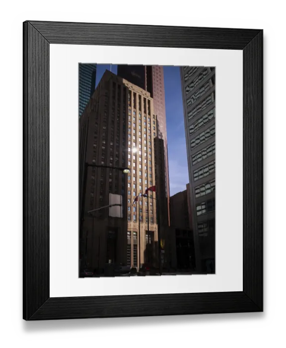 Framed Print : Urban scene with tall skyscrapers reflecting sunlight in a busy city setting in Toronto