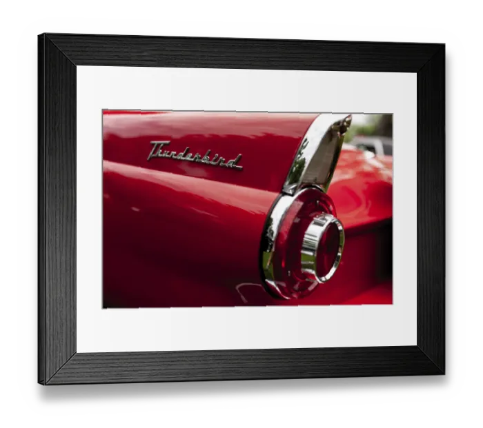 Framed Print : Rear view of a red classic Thunderbird highlighting its tail light and emblem in St