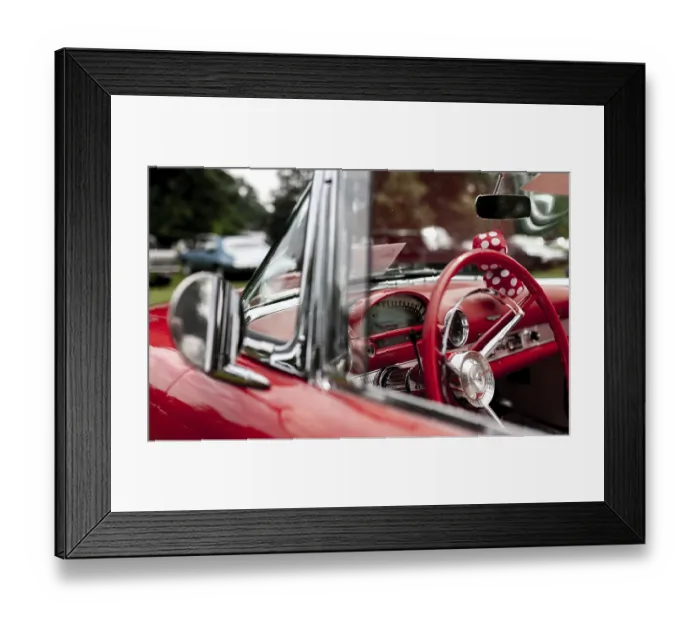 Framed Print : Interior of a red classic car showcasing the dashboard and polka dot decoration in St