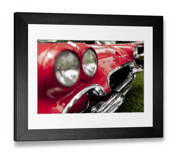 Framed Print : Close-up of a red vintage car's chrome headlights and grille