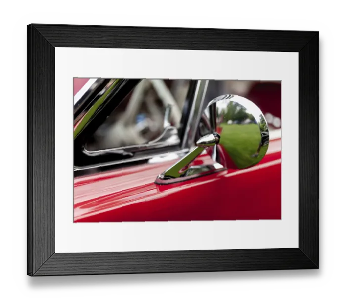 Framed Print : Close-up of a vintage car's side mirror in chrome with a red body in St