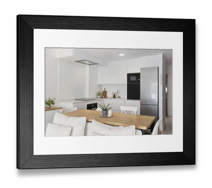 Framed Print : Bright and modern kitchen with sleek white cabinets and stainless steel appliances in the city center Framed Print : Bright and modern kitchen with sleek white cabinets and stainless steel appliances in the city center