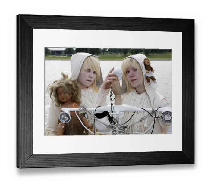 Framed Print : Two teens in white robes with doll and stuffed animal portraying fantasy characters Framed Print : Two teens in white robes with doll and stuffed animal portraying fantasy characters