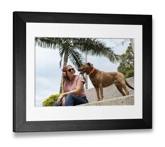 Framed Print : A woman, wearing red headphones and sunglasses