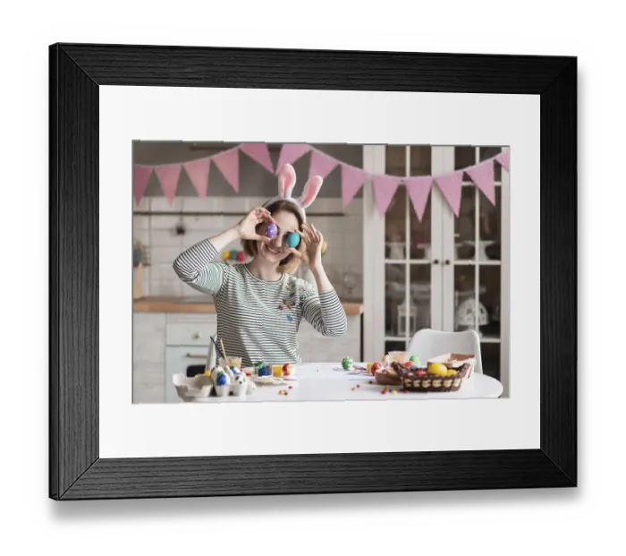 Framed Print : Cute adult woman playing with easter eggs Framed Print : Cute adult woman playing with easter eggs