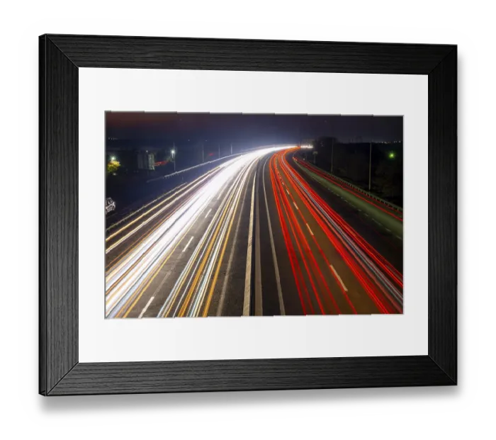 Framed Print : Suburban highway at night. Traces from headlights and taillights of heavy traffic Framed Print : Suburban highway at night. Traces from headlights and taillights of heavy traffic