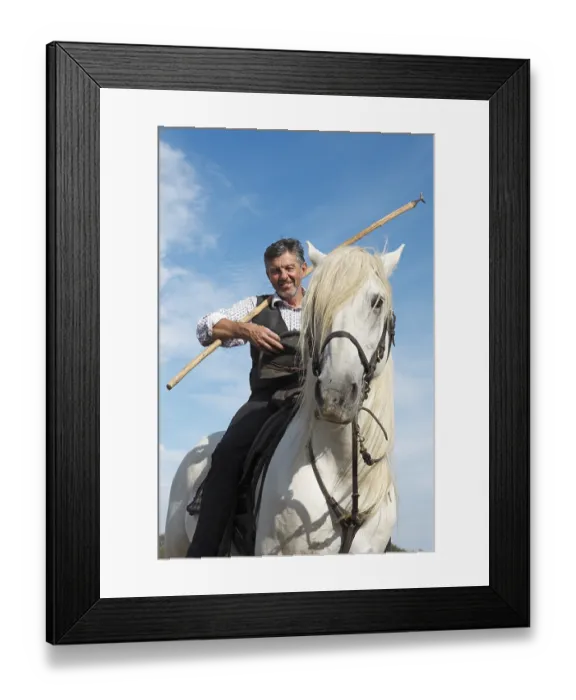Framed Print : Gardian or traditional bull herder in typical working clothes on a Camargue horse