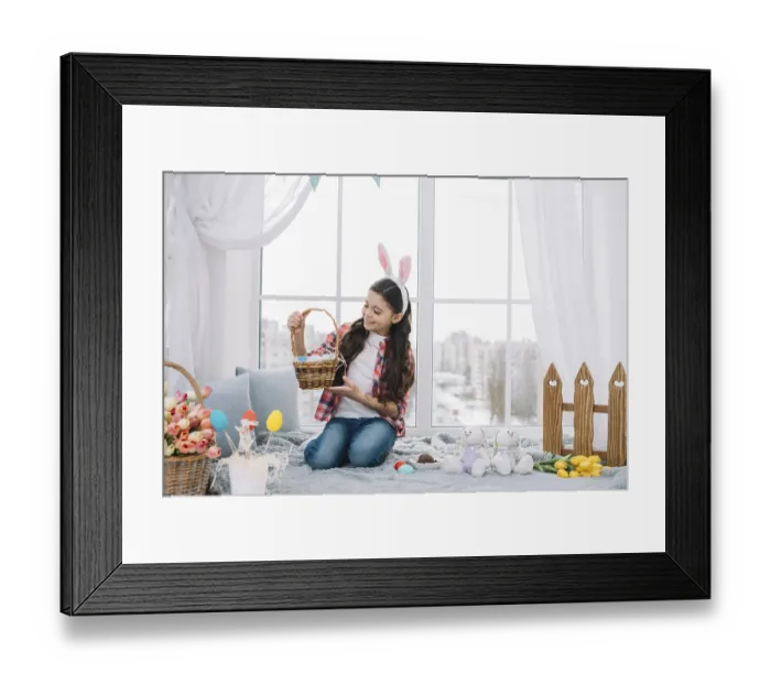 Framed Print : Girl sitting bed looking easter eggs basket home