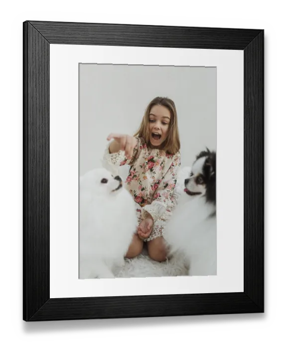Framed Print : Girl her dogs receiving treats Framed Print : Girl her dogs receiving treats