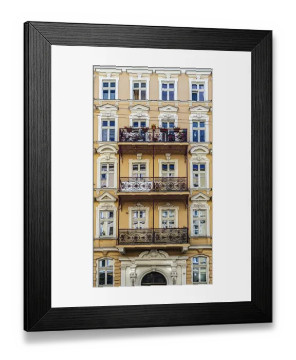 Framed Print : Historic row of colorful European buildings showcasing ornate architectural details including wrought iron balconies
