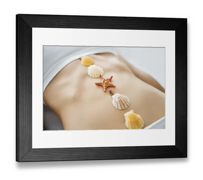 Framed Print : Sea shells and sea star on woman abdomen Framed Print : Sea shells and sea star on woman abdomen