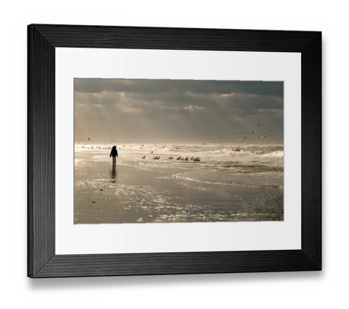 Framed Print : Girl silhouette on North sea beach and sky sunbeams Framed Print : Girl silhouette on North sea beach and sky sunbeams