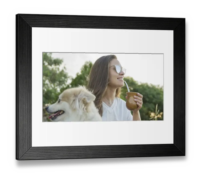 Framed Print : Brunette woman drinking traditional gaucho chimarrao with dog in the park Framed Print : Brunette woman drinking traditional gaucho chimarrao with dog in the park