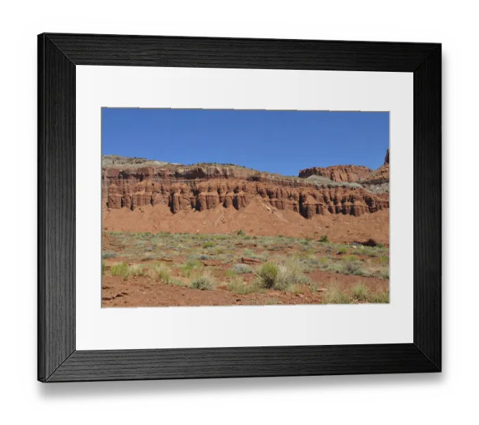 Framed Print : Red rock formation with low desert vegetation