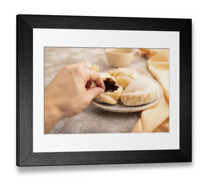 Framed Print : Glazed Pies with blueberry jam on brown concrete background and orange linen textile with hand
