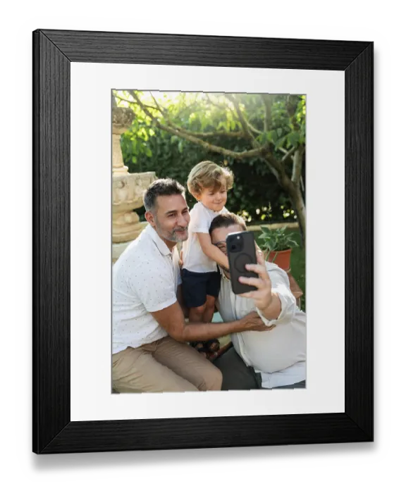 Framed Print : A joyful moment as a gay couple takes a selfie with their son in a sunlit garden Framed Print : A joyful moment as a gay couple takes a selfie with their son in a sunlit garden