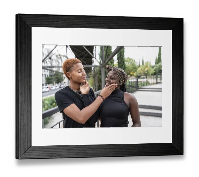 Framed Print : A joyful LGBT multiethnic couple shares a tender moment outdoors Framed Print : A joyful LGBT multiethnic couple shares a tender moment outdoors