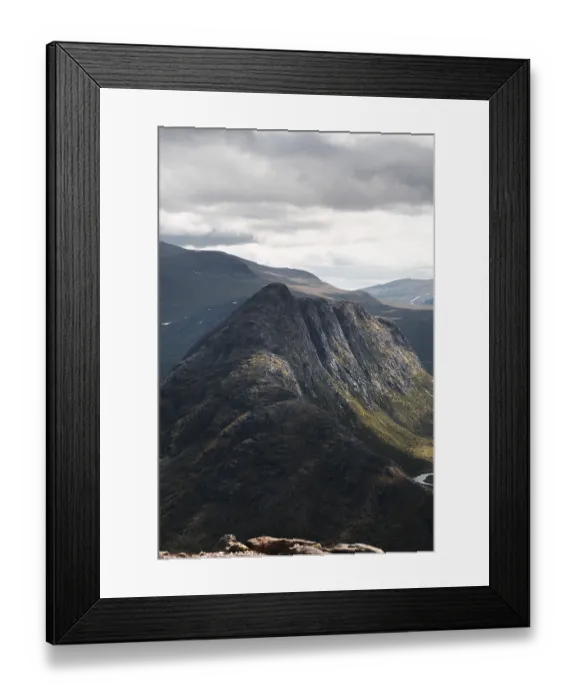 Framed Print : Breathtaking view of Norway's rugged mountains under cloudy skies Perfect for outdoor enthusiasts