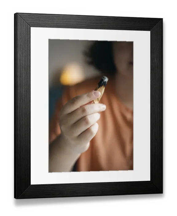 Framed Print : Cropped unrecognizable woman holds a smoldering Palo Santo stick Framed Print : Cropped unrecognizable woman holds a smoldering Palo Santo stick