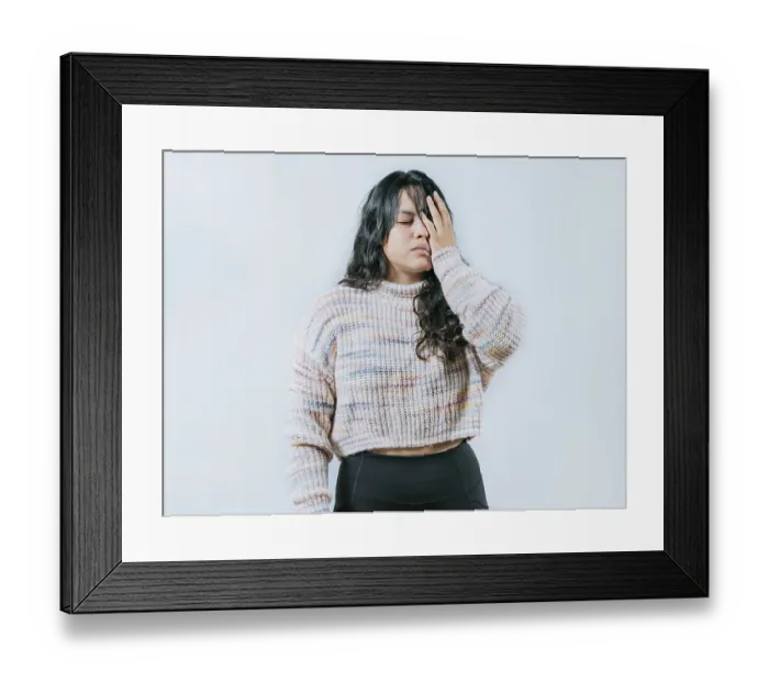 Framed Print : Exhausted young woman putting the palm on his face isolated Framed Print : Exhausted young woman putting the palm on his face isolated