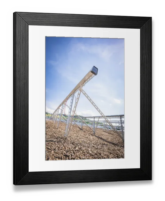 Framed Print : Close-up of a metal structure for solar modules under a clear blue sky Framed Print : Close-up of a metal structure for solar modules under a clear blue sky