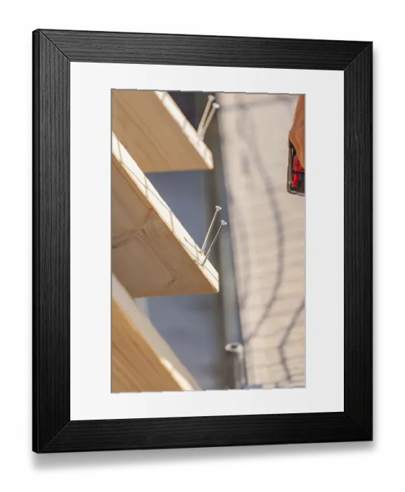Framed Print : Detailed view of screws screwed into a wooden board