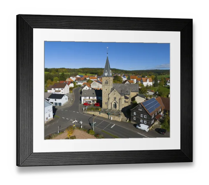 Framed Print : Close-up of a church in a village surrounded by roads and modern houses Framed Print : Close-up of a church in a village surrounded by roads and modern houses