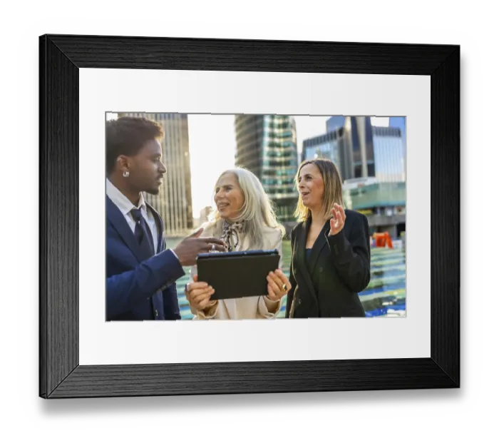 Framed Print : Diverse business team engaging in an informal outdoor meeting Framed Print : Diverse business team engaging in an informal outdoor meeting