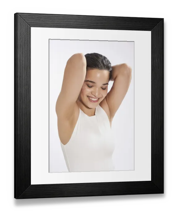 Framed Print : A joyful young female model with wet hair and glitter on her skin