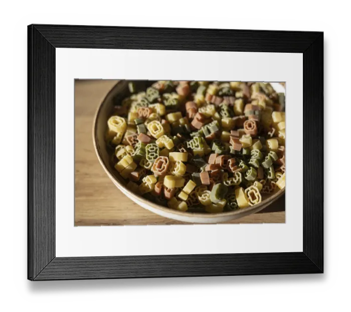 Framed Print : A bowl filled with multi-colored number shaped pasta featuring various digits